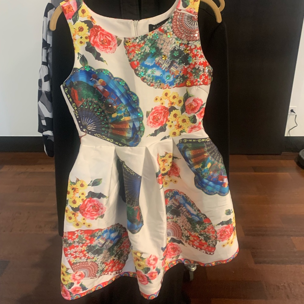 Never worn sequined floral dress. Good material.  Bought from Nevada love.